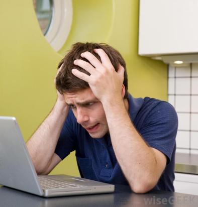 man-at-computer-with-hands-on-his-head-looking-at-computer.jpg
