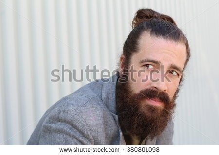 stock-photo-stylish-bearded-hipster-model-with-man-bun-hairstyle-lifestyle-in-the-street-depth-of-field-copy-380801098